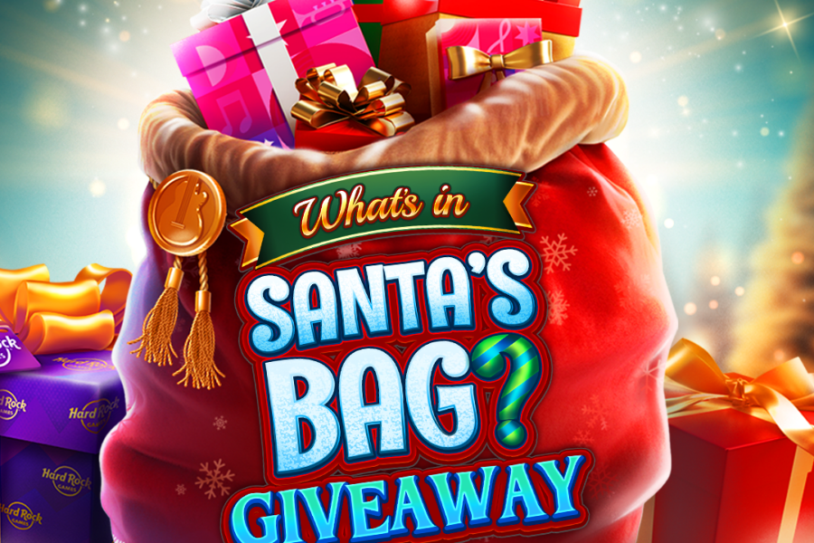 Santa’s bag giveaway banner featuring a red sack filled with colorful gift boxes and festive decorations.